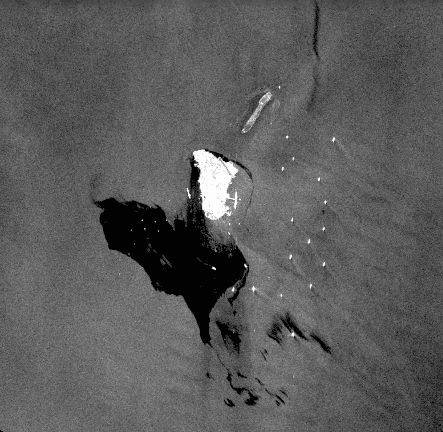 Sentinel-1 SAR ascending pass, 6 May 2026 — Kharg Island oil terminal (bright) with large dark oil slick extending south into the Persian Gulf